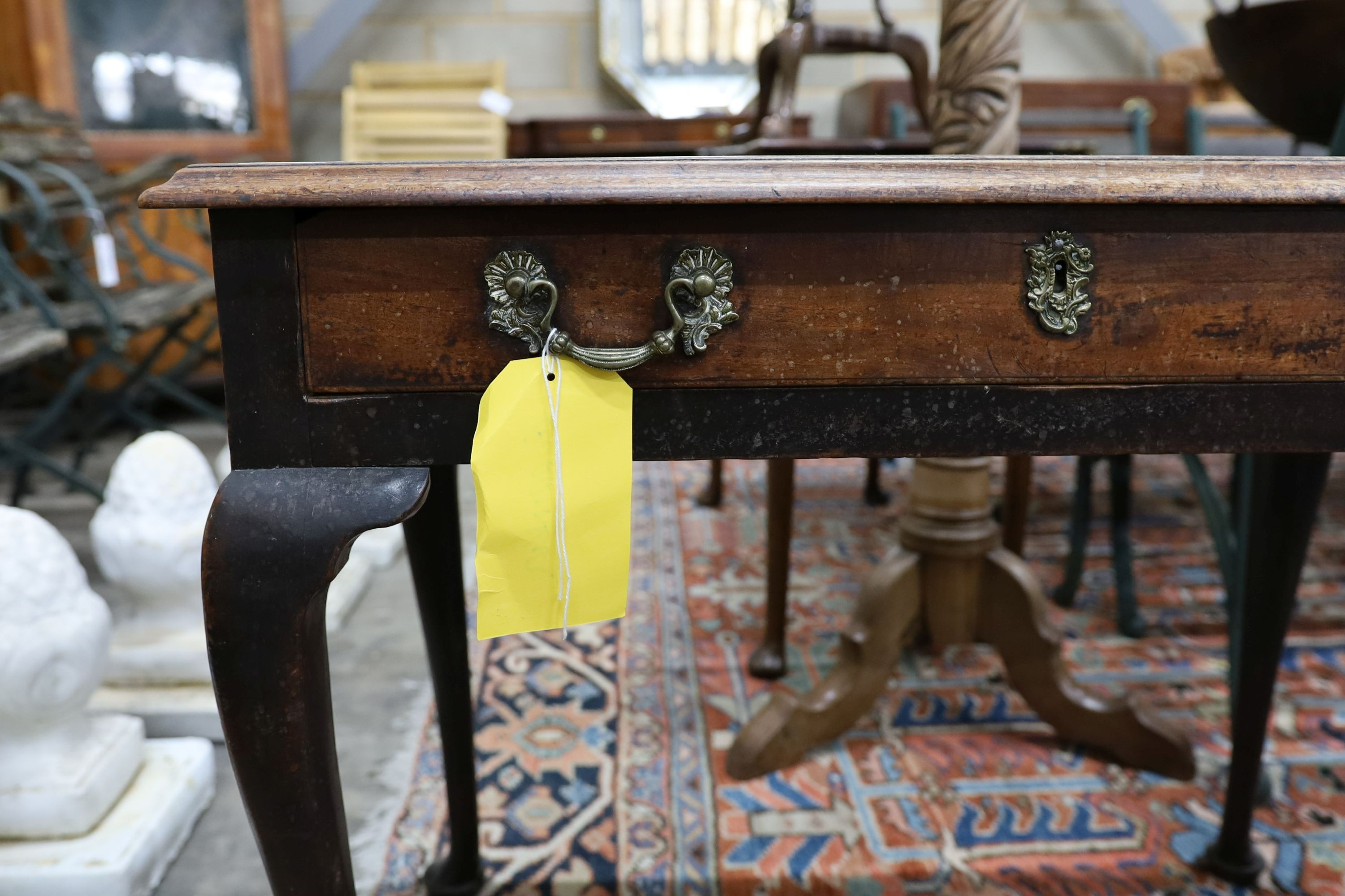 A George III mahogany side table, fitted with a single drawer, on cabriole legs, width 83cm, depth 48cm, height 67cm